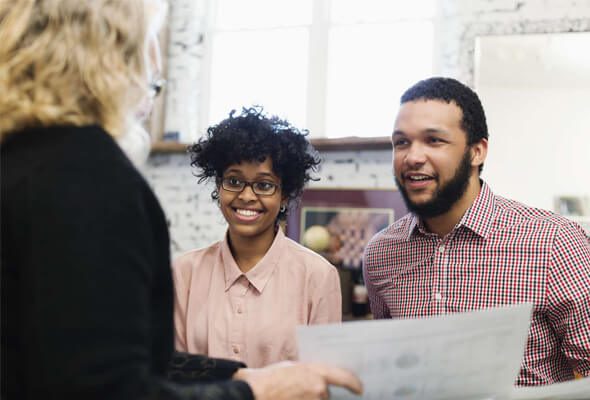 couple talking to a lender