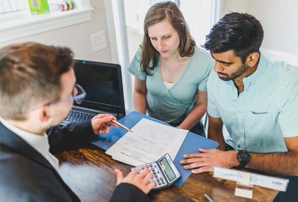 couple talking to mortgage broker