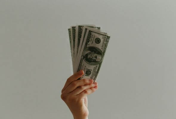 holding a cash
